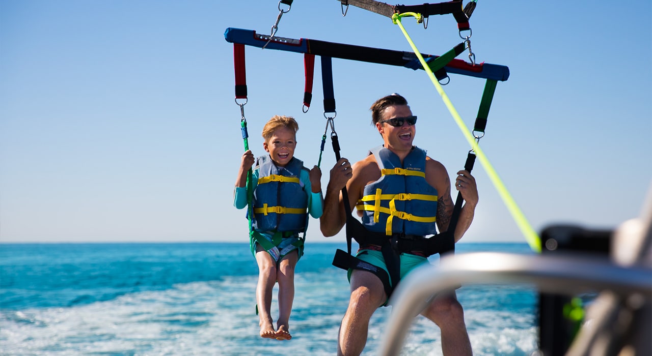 father and son parasailing in destin florida