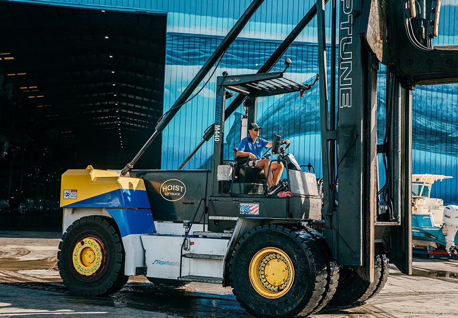 Man driving forklift working at Legendary marina