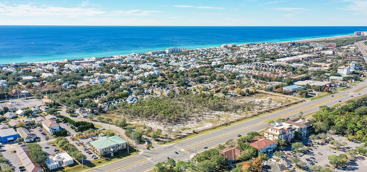 aerial of the building area with the ocean and homes